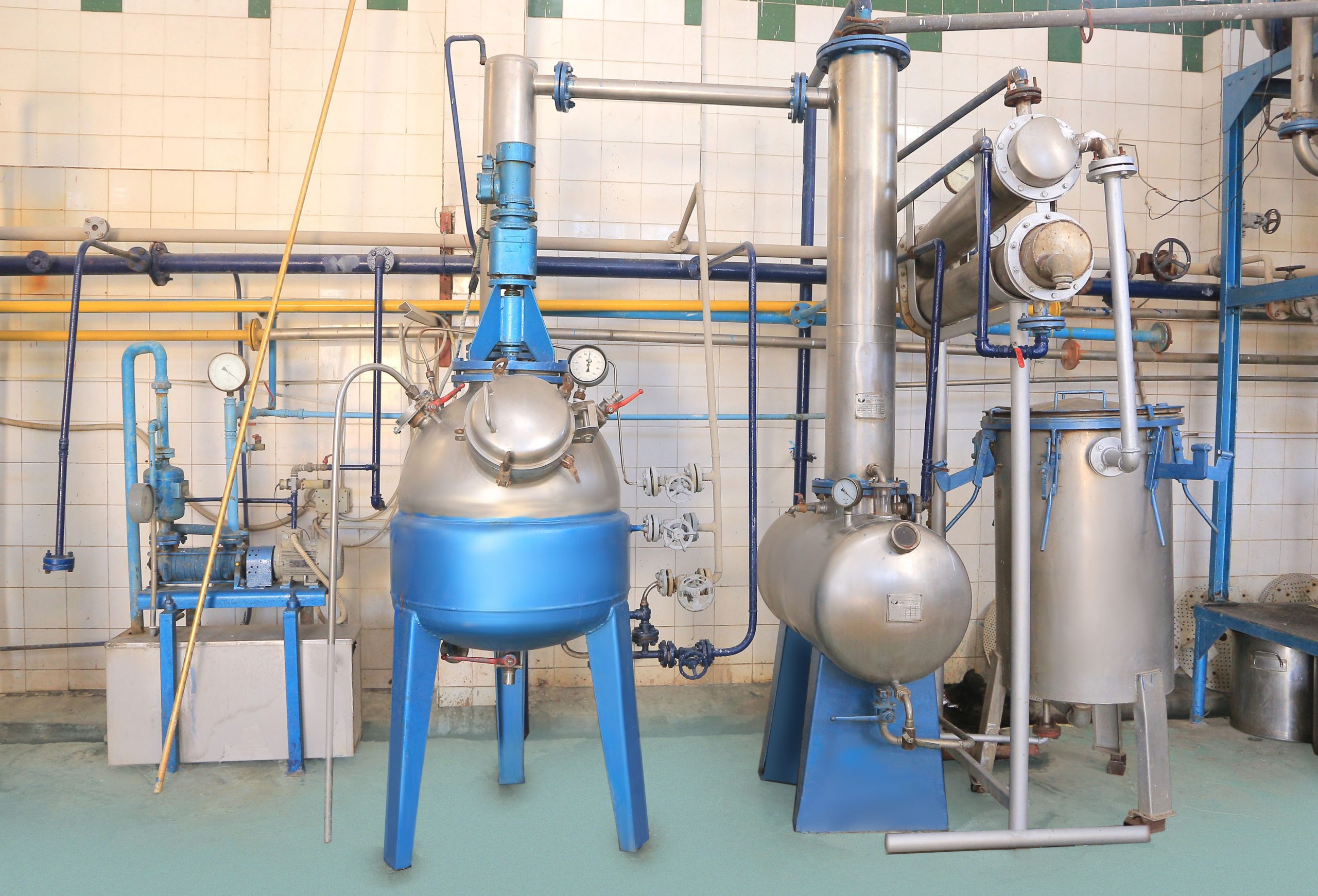 Row of outdoor distillation stills at the Sadat City facility